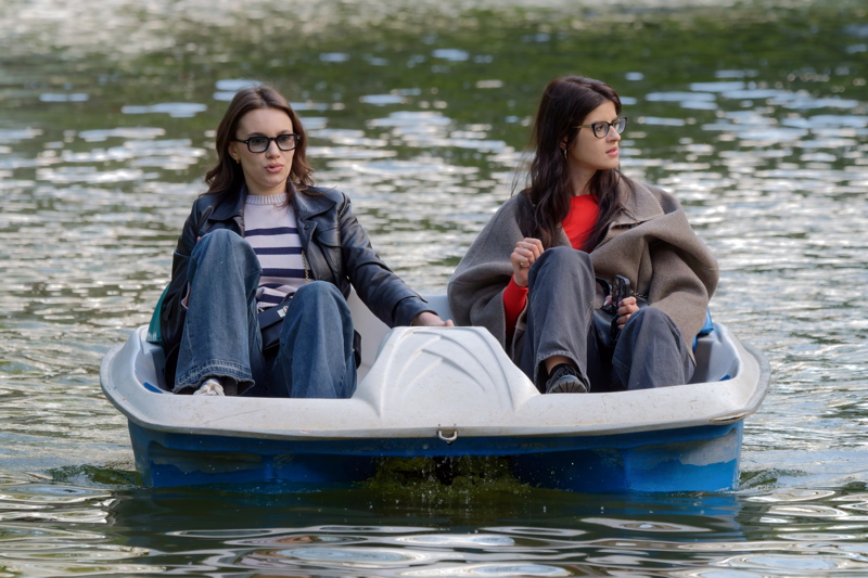 Two young women in a pedal boat